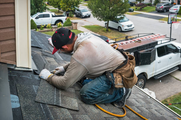 Professional Roof Replacement technician working in Paris, MI